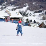 Child on skis at Kronplatz ski resort